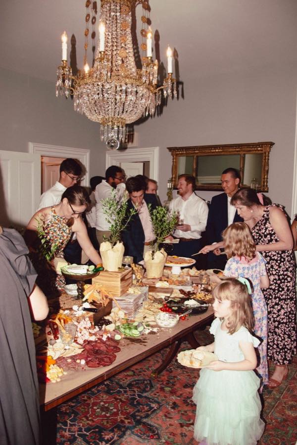 A crowd at a branded event adding photos to one shared album from their own phones
