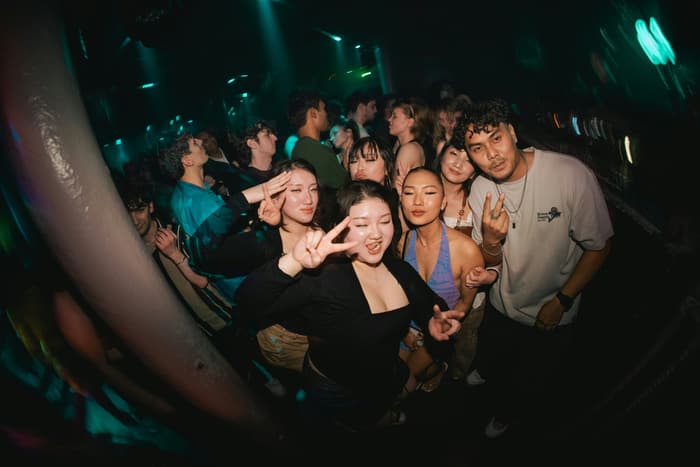 Friends crowding into a selfie at a club