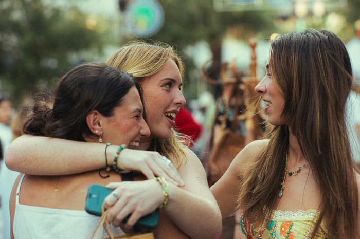 Friends hugging at a garden party